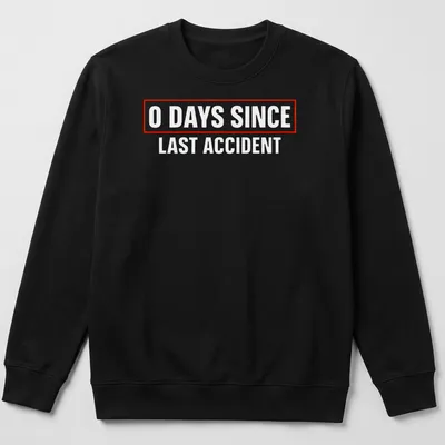 Humorous quote shirt with bold text stating '0 Days Since Last Accident' in red and white. — printed on a unisex sweatshirt