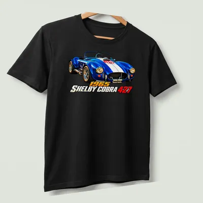 Realistic print of a 1965 Shelby Cobra 427 racing car in blue, white, and red — printed on a unisex t-shirt (angled view)