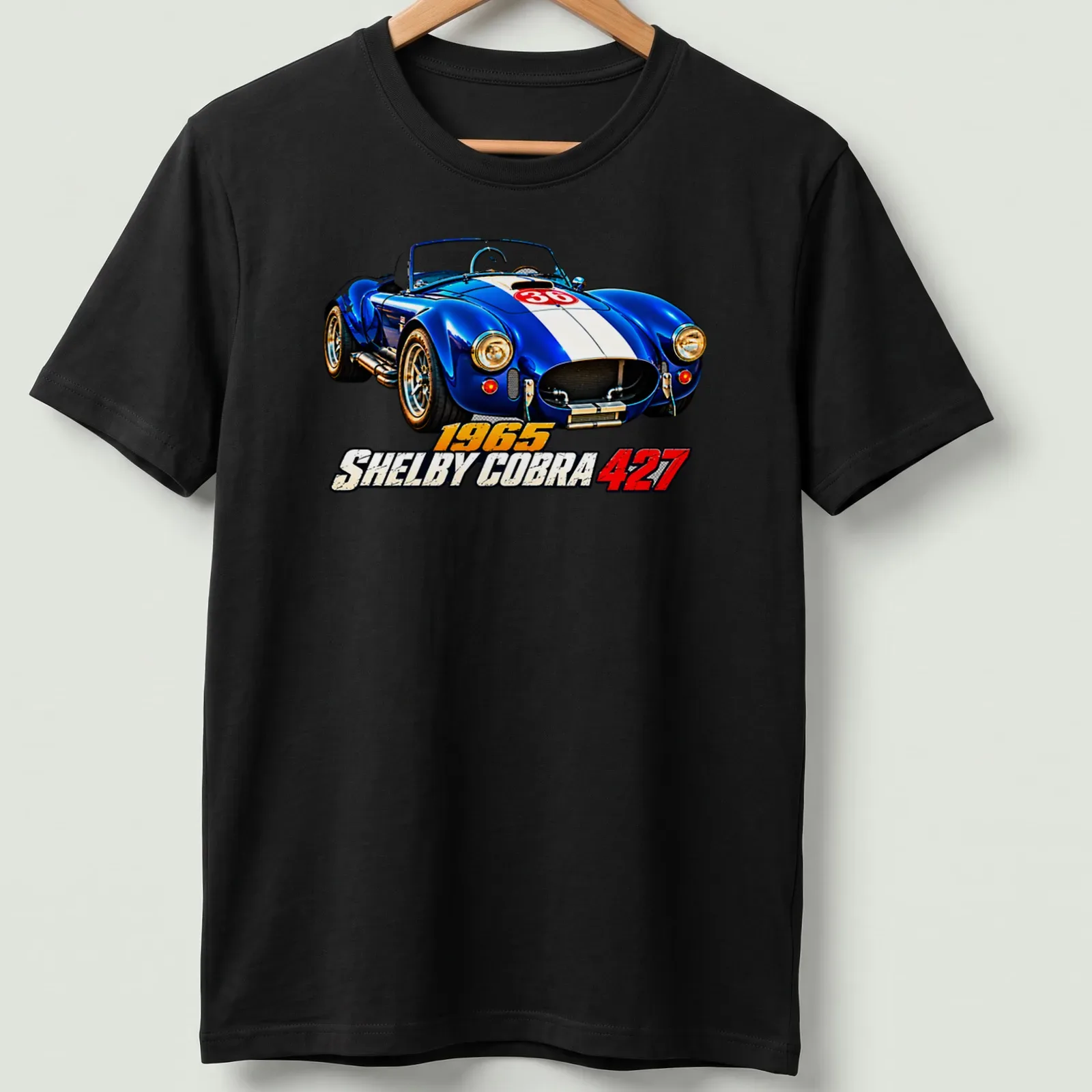 Realistic print of a 1965 Shelby Cobra 427 racing car in blue, white, and red — printed on a unisex t-shirt