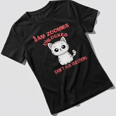 Cute cartoon cat t-shirt with pink and black text about late-night zoomies — printed on a women's shirt