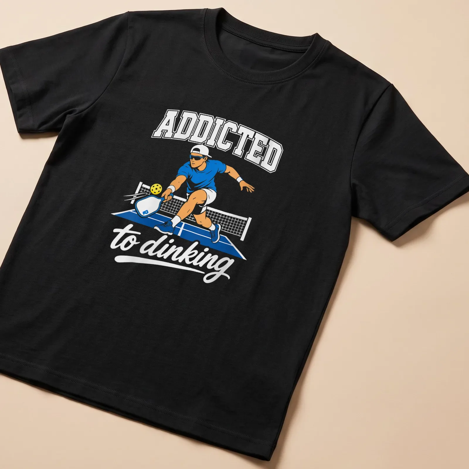 Vector illustration of a pickleball player with text Addicted to Dinking — printed on a unisex t-shirt