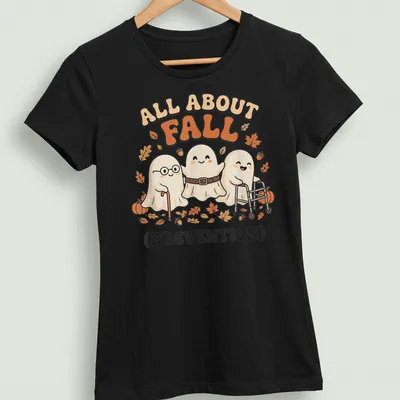 Kawaii cartoon ghosts with the text 'All About Fall (Prevention)' in warm colors — printed on a women's shirt