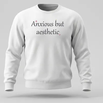 Cute mental health quote in cursive: Anxious but aesthetic, in black, pink, and gold. — printed on a unisex sweatshirt