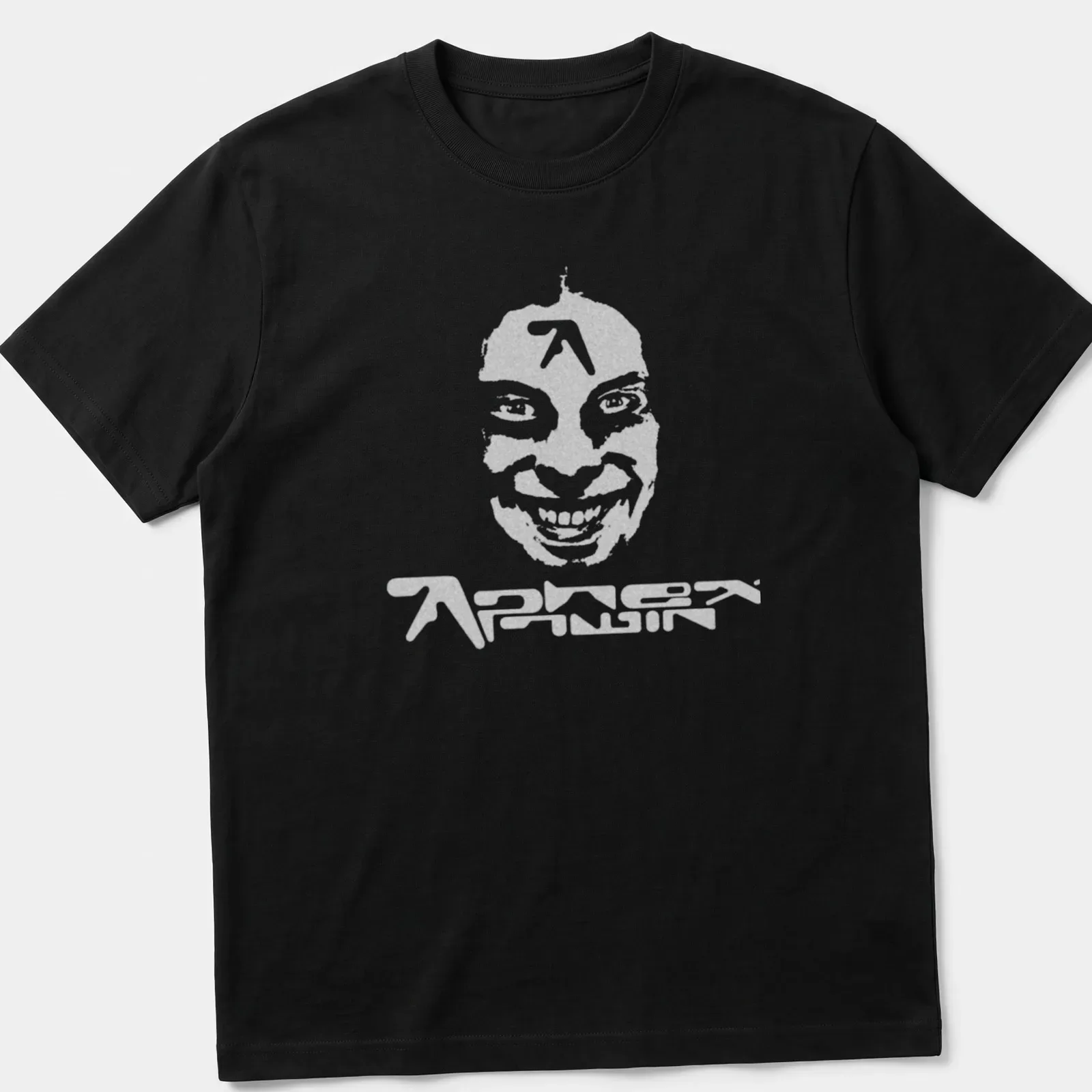 Distressed Aphex Twin T-shirt featuring a stylized face in gray and white — printed on a unisex t-shirt