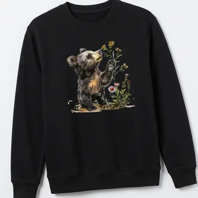 Watercolor illustration of a bear cub surrounded by flowers in soft colors — printed on a unisex sweatshirt