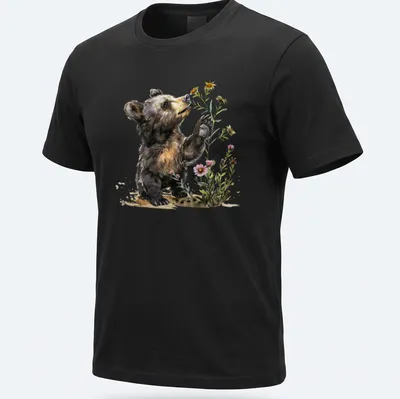 Watercolor illustration of a bear cub surrounded by flowers in soft colors — printed on a unisex t-shirt