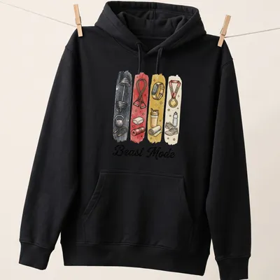 Illustrative shirt with Beast Mode text and gym equipment graphics in bold colors — printed on a unisex hoodie