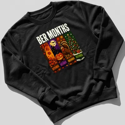 Colorful cartoon design featuring Halloween, Thanksgiving, and Christmas themes with the text 'BER MONTHS' — printed on a unisex sweatshirt