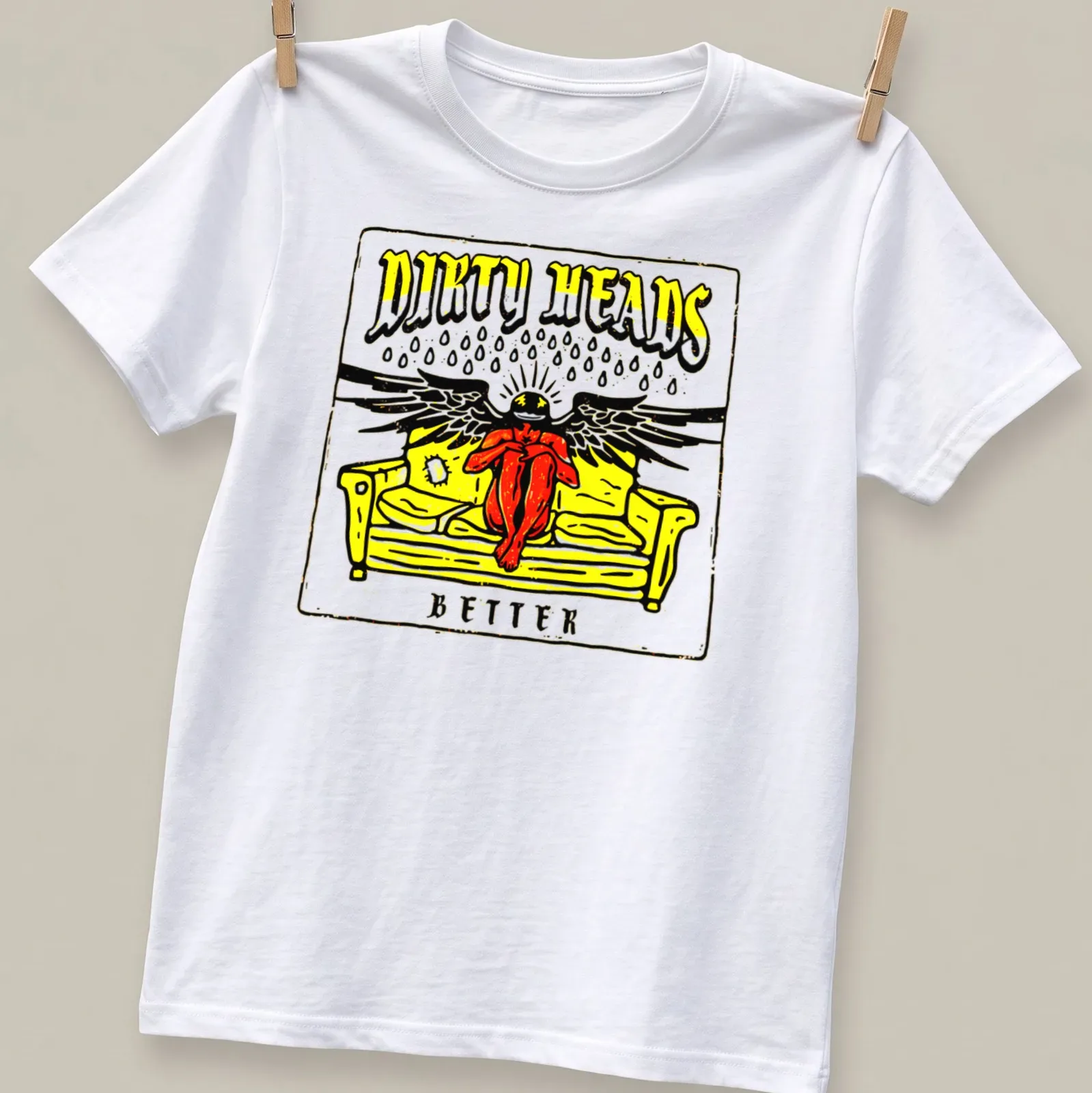 Bold graphic of a person with wings on a sofa, featuring the text 'DIRTY HEADS BETTER' in yellow, black, red, and white. — printed on a unisex t-shirt