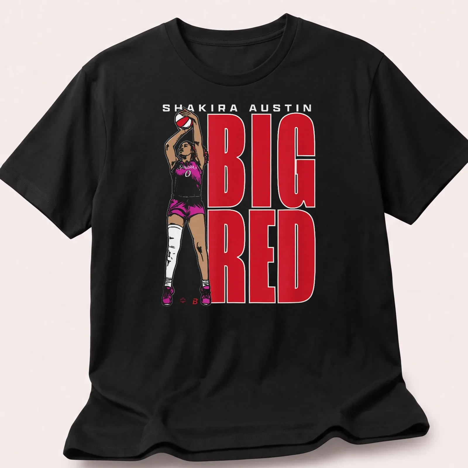 Bold graphic of basketball player Shakira Austin with red and white text — printed on a unisex t-shirt