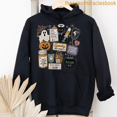 Kawaii doodle black cat Halloween shirt with colorful playful text — printed on a unisex hoodie