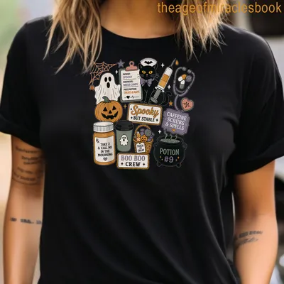 Kawaii doodle black cat Halloween shirt with colorful playful text — printed on a women's t-shirt