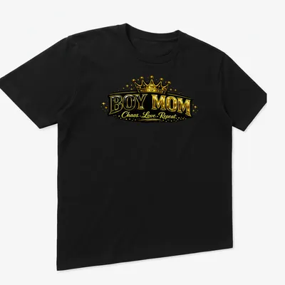 Bold Boy Mom shirt featuring a crown design in shiny gold and black text — printed on a unisex t-shirt (angled view)