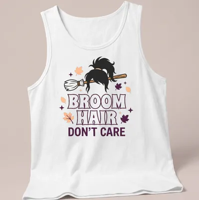 Cartoon broomstick with hair and text reading 'Broom Hair Don't Care' in Halloween colors — printed on a tank top