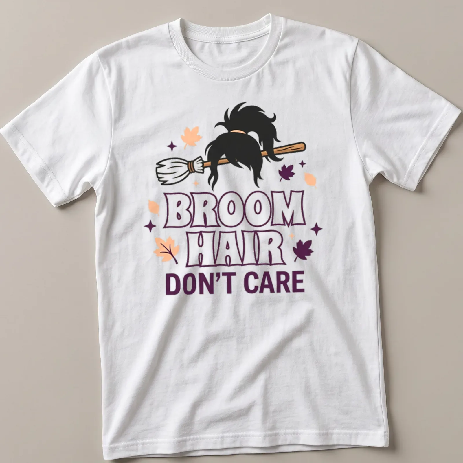 Cartoon broomstick with hair and text reading 'Broom Hair Don't Care' in Halloween colors — printed on a unisex t-shirt