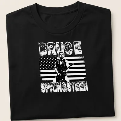 Vintage distressed Bruce Springsteen T-shirt with bold lettering and guitarist graphic — printed on a unisex t-shirt