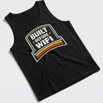 Retro humor t-shirt with 'BUILT BEFORE WIFI' in a badge design — printed on a tank top