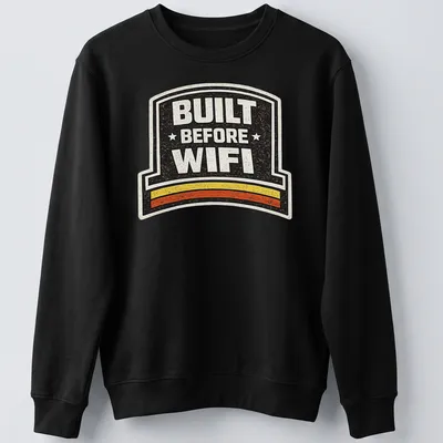 Retro humor t-shirt with 'BUILT BEFORE WIFI' in a badge design — printed on a unisex sweatshirt