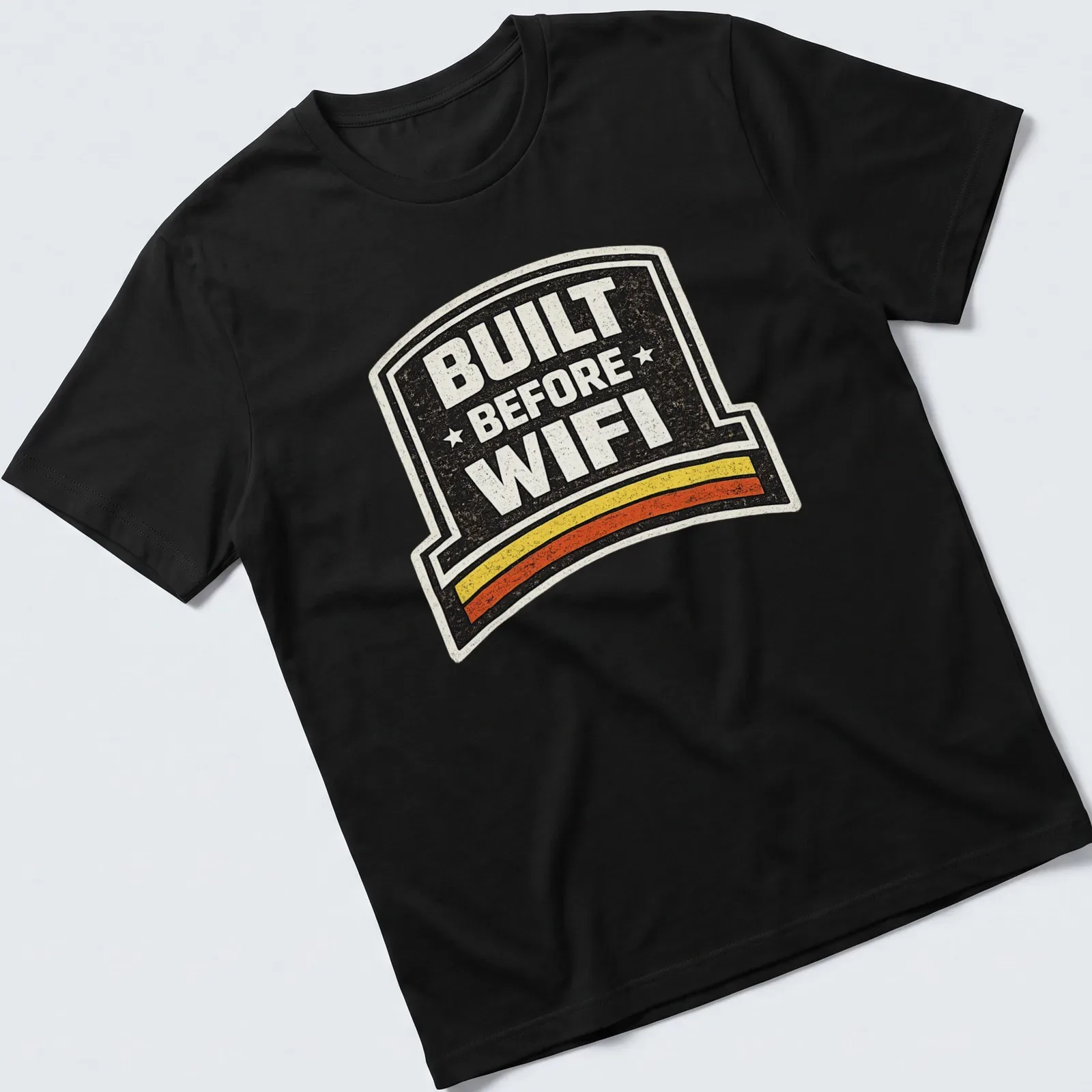 Retro humor t-shirt with 'BUILT BEFORE WIFI' in a badge design — printed on a unisex t-shirt