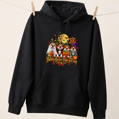Colorful cartoon Bulldogs in Halloween costumes with humorous text. — printed on a unisex hoodie
