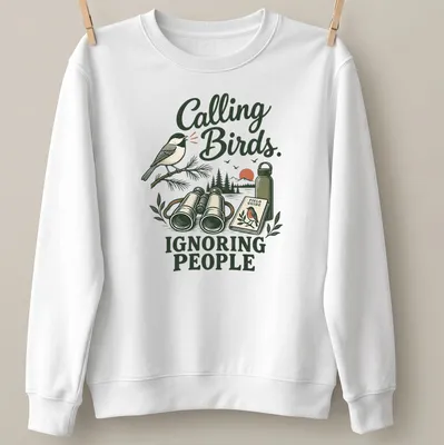 Vintage illustration of a bird with the text 'Calling Birds. Ignoring People' — printed on a unisex sweatshirt