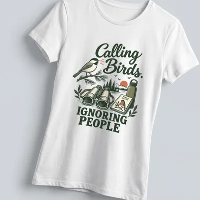 Vintage illustration of a bird with the text 'Calling Birds. Ignoring People' — printed on a women's shirt