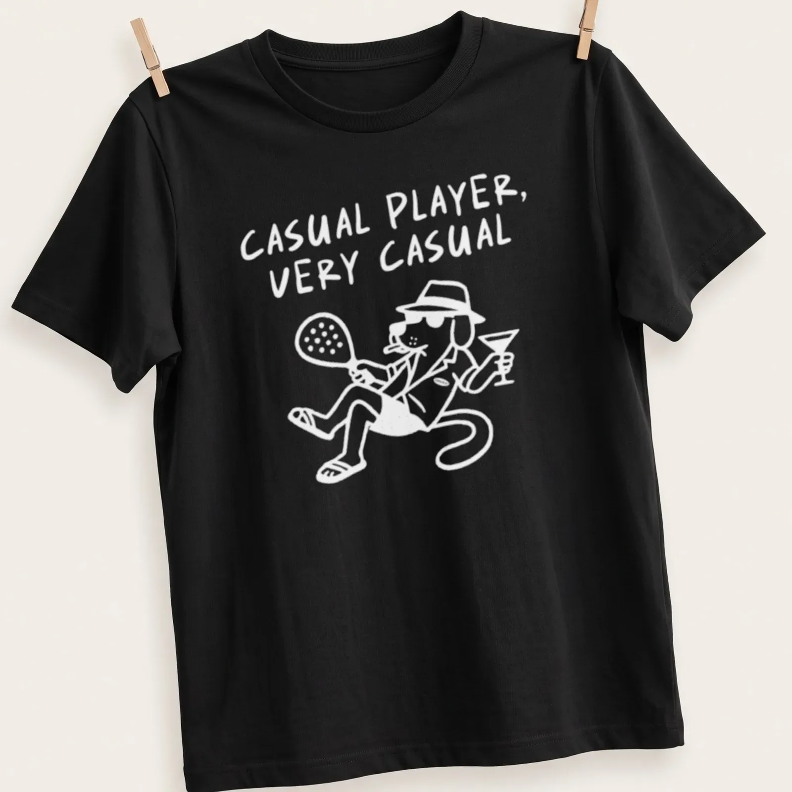 Modern graphic of a tennis padel player with the text Casual Player — printed on a unisex t-shirt