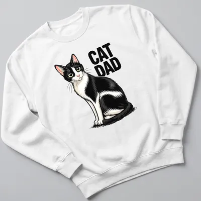 Cartoon design of a black and white cat with 'CAT DAD' text in playful font — printed on a unisex sweatshirt