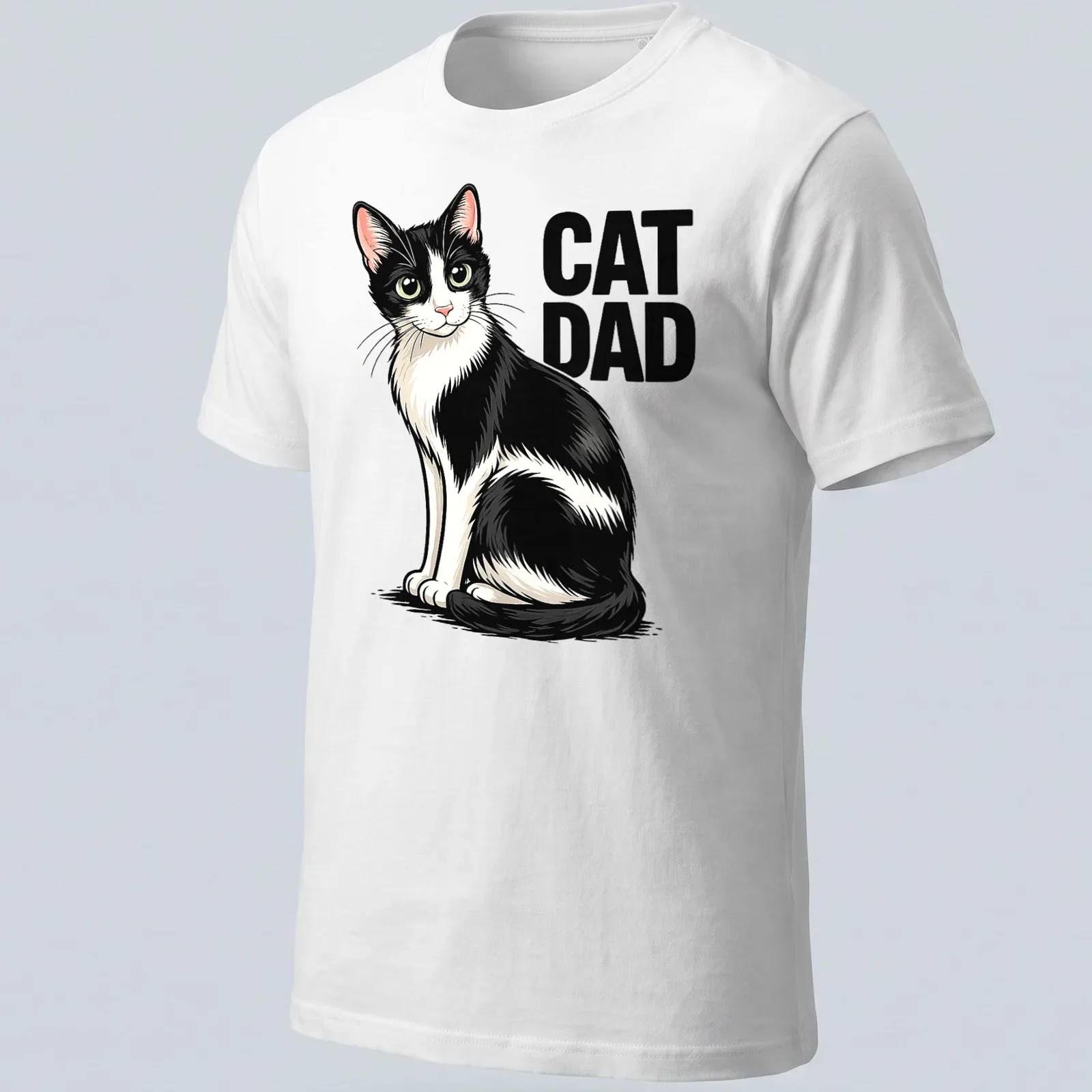 Cartoon design of a black and white cat with 'CAT DAD' text in playful font — printed on a unisex t-shirt