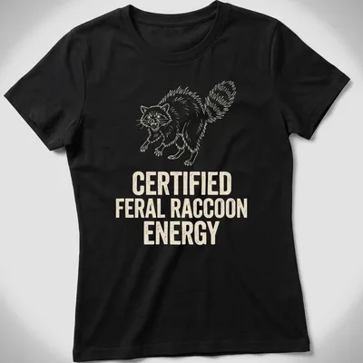 Line-art design of a feral raccoon with text declaring 'Certified Feral Raccoon Energy' — printed on a women's shirt