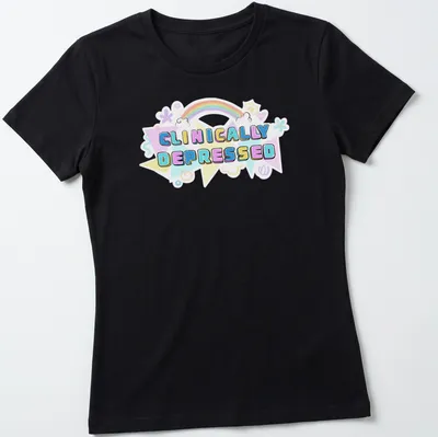Kawaii T-shirt featuring rainbow design and the text 'CLINICALLY DEPRESSED' in pastel colors — printed on a women's shirt