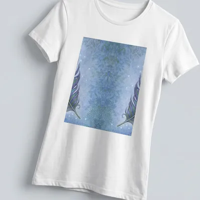 Watercolor depiction of peacock feathers in blue, green, and purple — printed on a women's shirt
