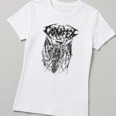 Gothic t-shirt featuring a skeleton in a coffin with CARNIFEX text — printed on a women's shirt