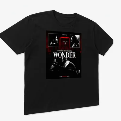 Gothic T-shirt with vintage horror design featuring vampires and ornate lettering. — printed on a unisex t-shirt (angled view)
