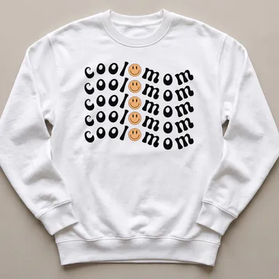 Bold playful Cool Mom T-shirt with smiley face graphic in black, yellow, and peach — printed on a unisex sweatshirt