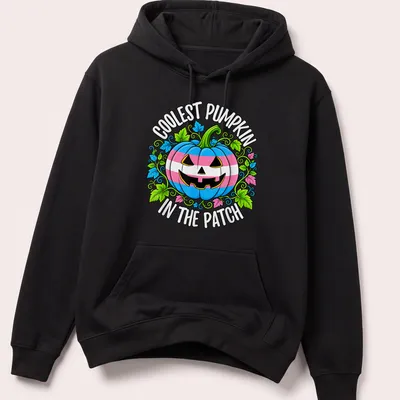 Cartoonish pumpkin design with colorful Trans pride colors and playful text — printed on a unisex hoodie