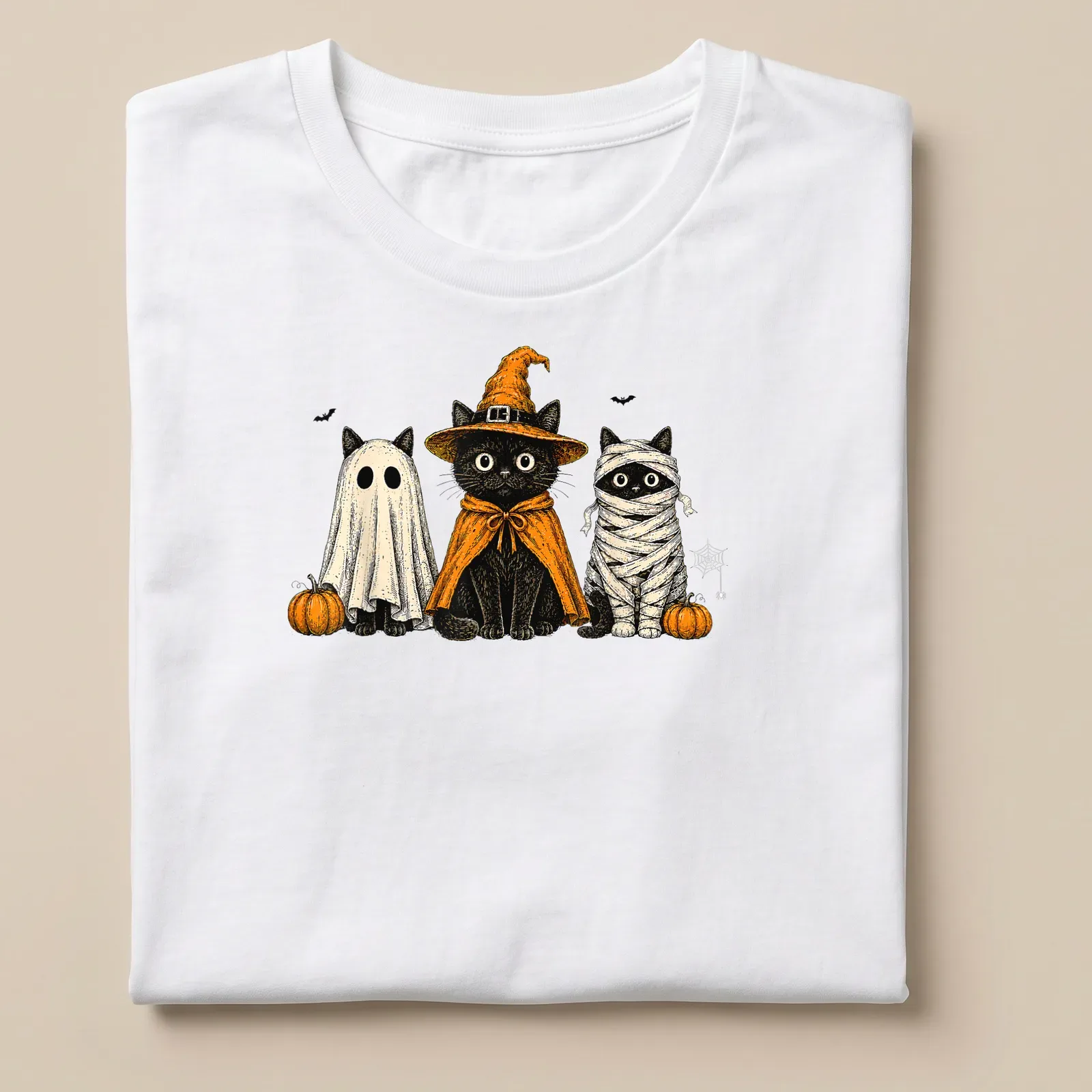 Vintage illustration of black cats in Halloween costumes including ghost and pumpkin — printed on a unisex t-shirt