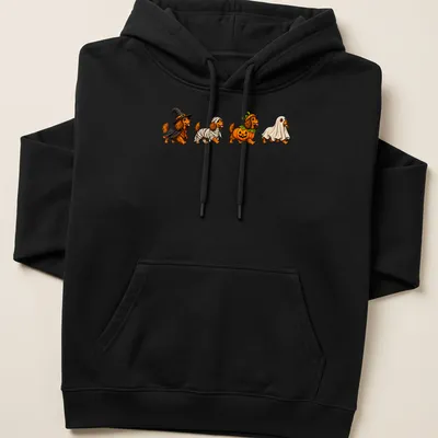 Colorful cartoon of Dachshund dogs in Halloween costumes — printed on a unisex hoodie