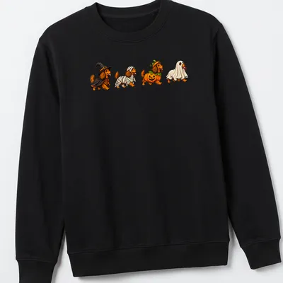 Colorful cartoon of Dachshund dogs in Halloween costumes — printed on a unisex sweatshirt