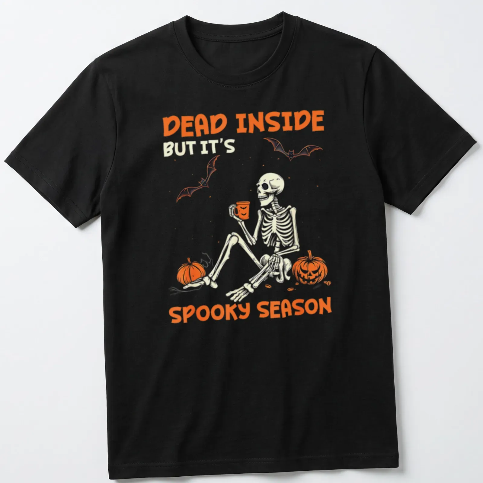 A playful skeleton surrounded by pumpkins with Halloween-themed text — printed on a unisex t-shirt