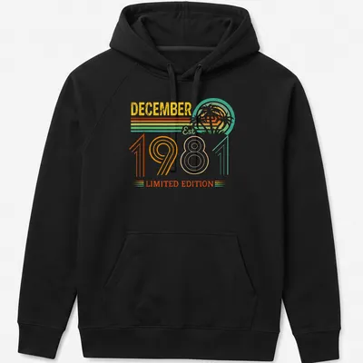 Vintage retro T-shirt with a tropical sunset and palm trees, celebrating December 1981. — printed on a unisex hoodie