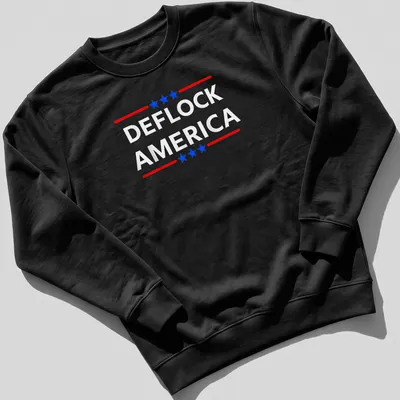 Bold patriotic design featuring the phrase DEFLOCK AMERICA in red, blue, and white. — printed on a unisex sweatshirt