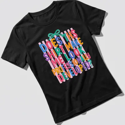 Colorful typography t-shirt with playful text about professional development — printed on a women's shirt