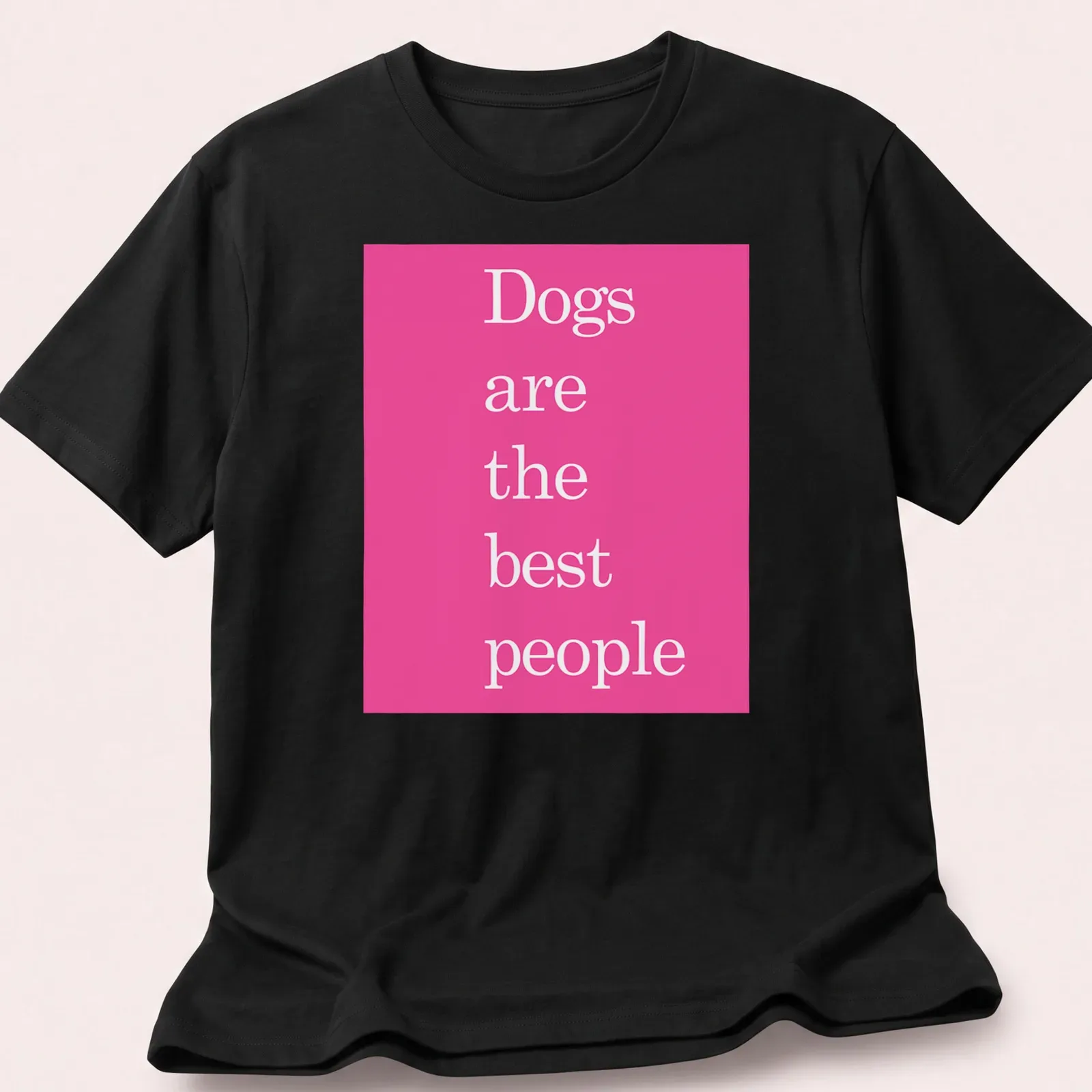 Minimalist pink t-shirt featuring the phrase 'Dogs are the best people' — printed on a unisex t-shirt