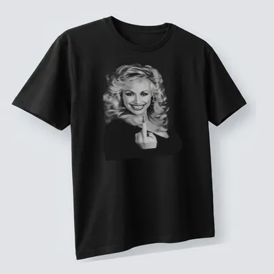 Vintage Dolly Parton t-shirt featuring an illustrated portrait in black and white — printed on a unisex t-shirt (angled view)