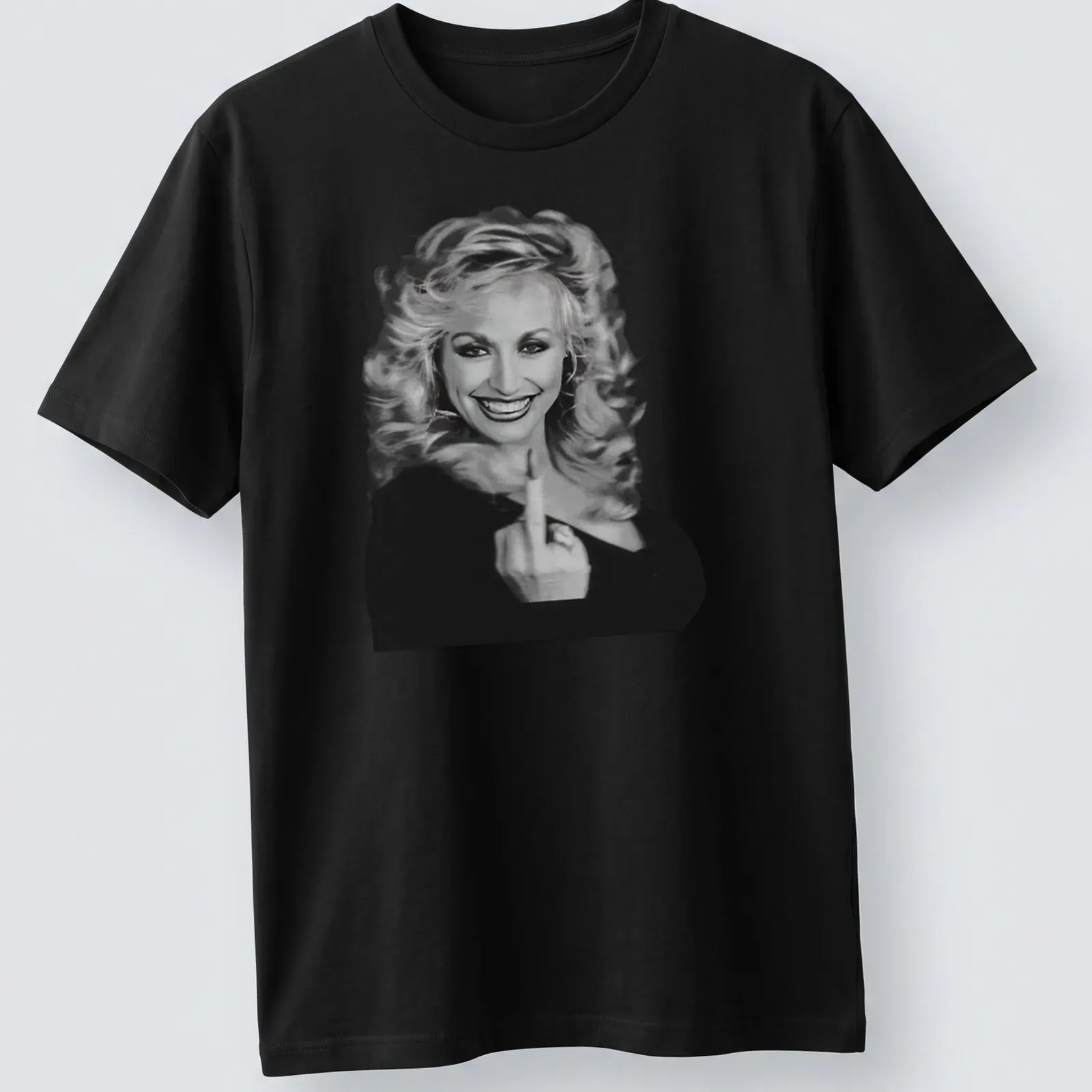 Vintage Dolly Parton t-shirt featuring an illustrated portrait in black and white — printed on a unisex t-shirt