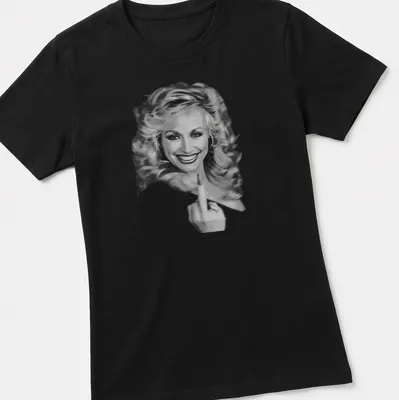 Vintage Dolly Parton t-shirt featuring an illustrated portrait in black and white — printed on a women's shirt