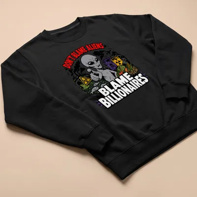 Cartoon alien design with text Don't Blame Aliens Blame Billionaires in green and black — printed on a unisex sweatshirt