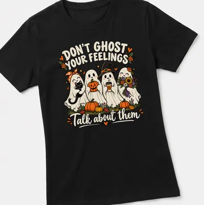 Colorful cartoon t-shirt featuring friendly ghosts with pumpkins and flowers — printed on a women's shirt