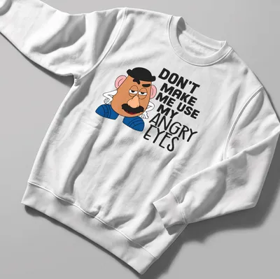 Cartoon potato character with angry eyes and humorous text. — printed on a unisex sweatshirt